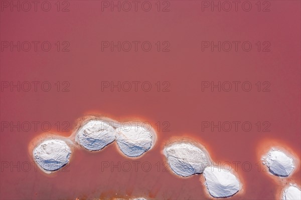 Aerial view of a salt works with salt heaps