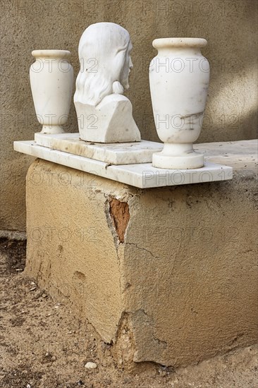 Simple grave with crumbling plaster