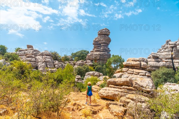 Trekking in the Torcal de Antequera on the green and yellow trail walking along the path