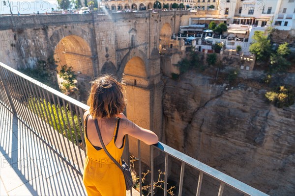 A tourist at the viewpoint visiting the new bridge in Ronda province of Malaga