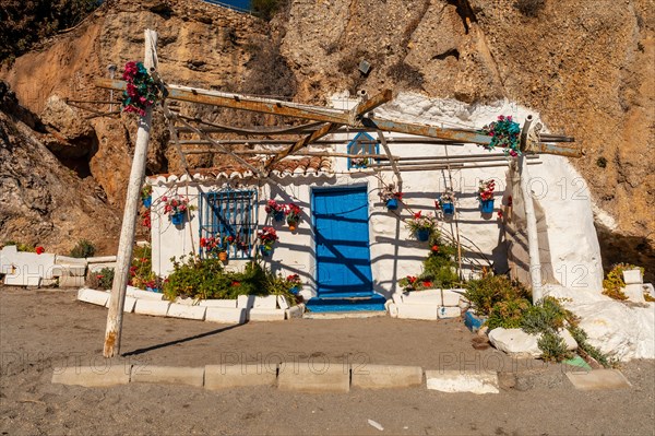 A construction of a white house on the Calahonda beach in the town of Nerja