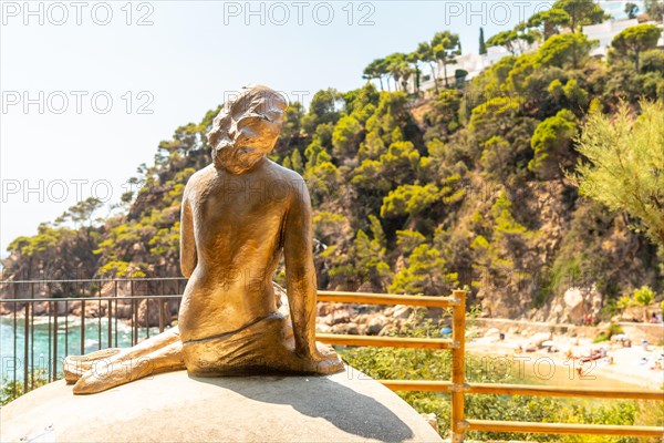 Mermaid sculpture in Cala Canyet next to the town of Tossa de Mar. Girona