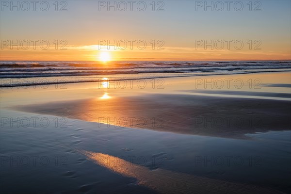 Atlantic ocean sunset with surging waves at Fonte da Telha beach