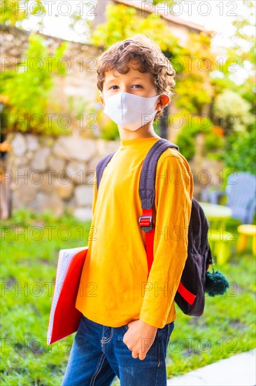 Caucasian child with face mask ready for back to school. New normality