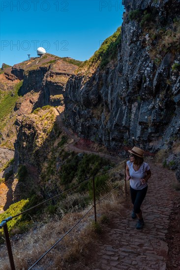 A young woman on the trail to the Ninho da