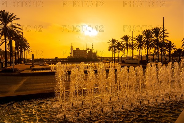 Orange sunset at the fountains of the Rambla de Almeria