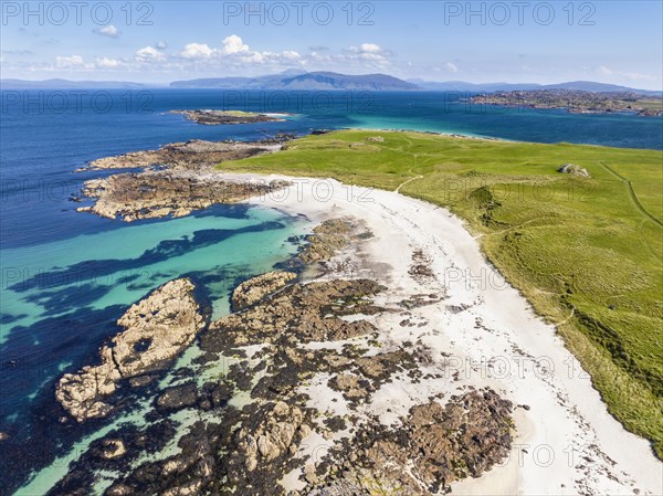 Aerial view of Traigh An T-Suidhe sandy beach on the north side of the Isle of Iona