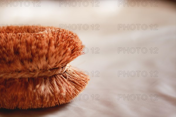 Close up to a body brush with organic and natural bristles