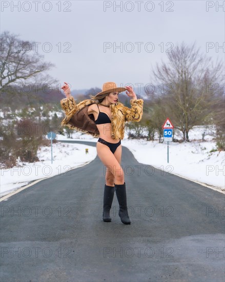Model girl in underwear on a road