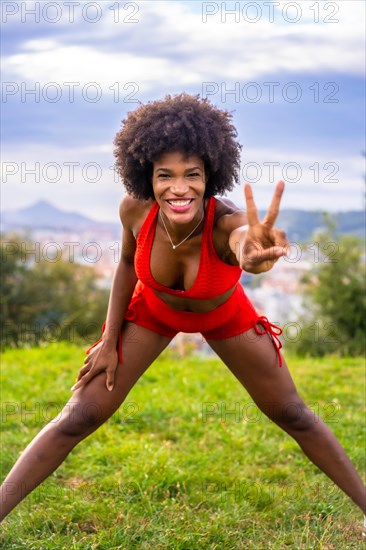 Fitness with a young black girl with afro hair