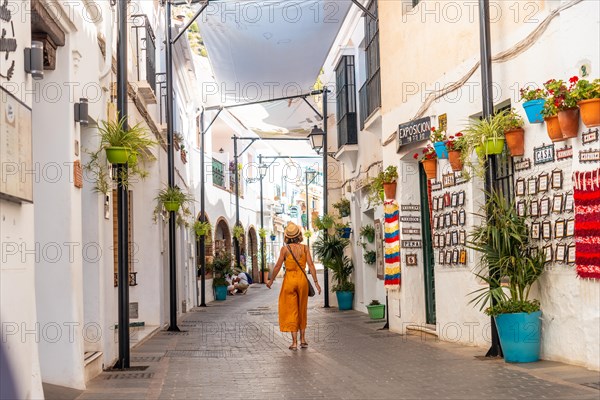 A tourist in the white houses walking in the municipality of Mijas in Malaga. Andalusia