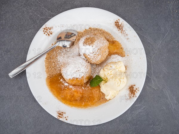 Apricot dumplings with sugar and cinnamon