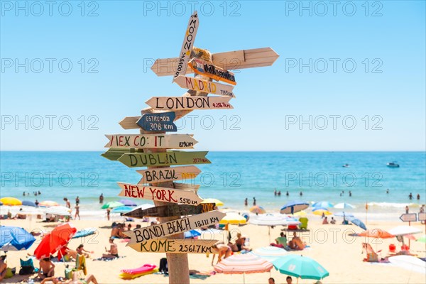 Town signs on the beach at Praia do Barranco das Belharucas