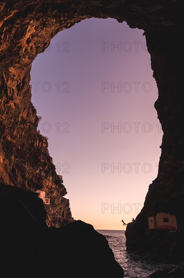 Sunset from inside the cave of the town of Poris de Candelaria on the north-west coast of the island of La Palma