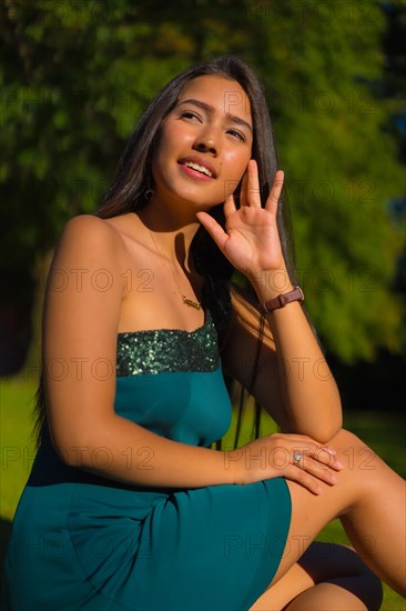 A pretty young brunette Latina with long straight hair