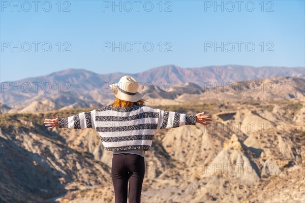 A young hiker enjoying freedom in the desert canyon of Tabernas