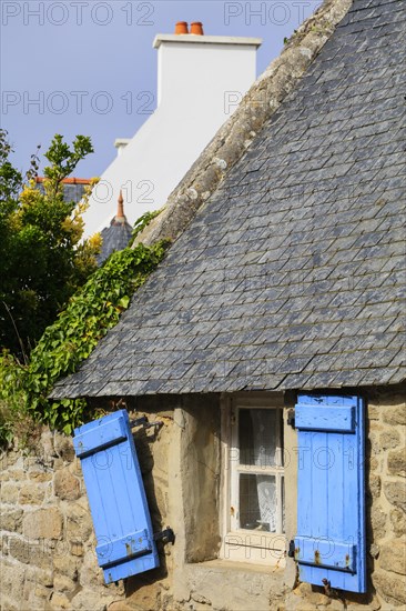 Stone house with blue shutters