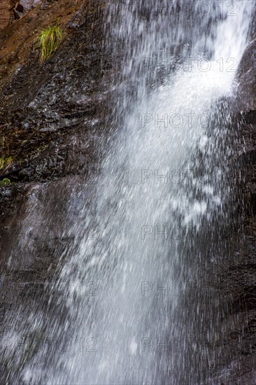 Water splashing in the collision between the waterfall and the rocks in Minas Gerais