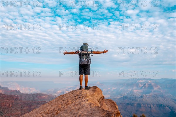 A young man on a viewpoint of the descent of the South Kaibab Trailhead. Grand Canyon