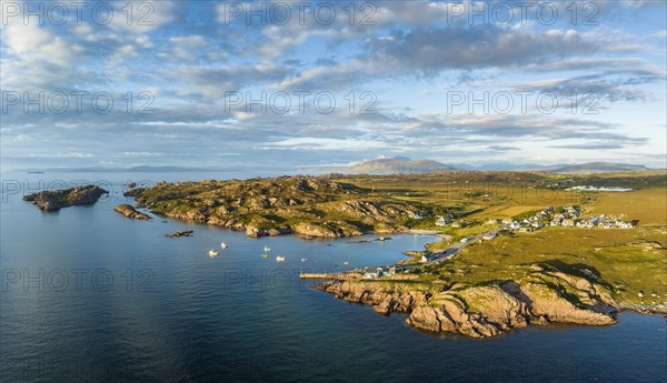 Aerial panorama of the coastline of the Ross of Mull peninsula with the fishing village of Fionnphort