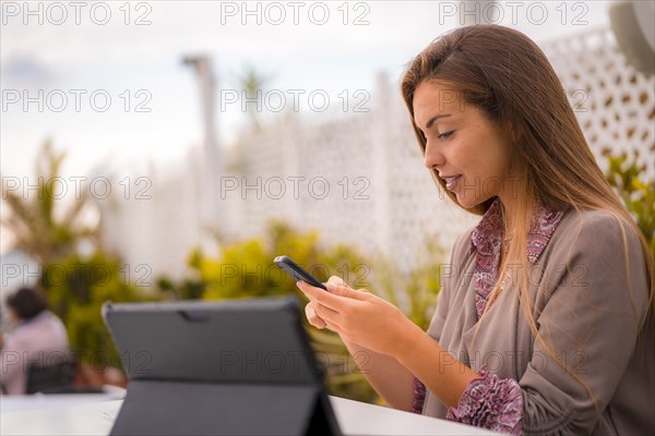 Executive woman and businesswoman having breakfast in a restaurant having a decaffeinated coffee