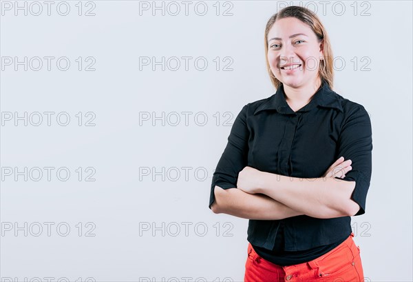 Beautiful young latin woman with arms crossed isolated. Attractive latin woman with arms crossed isolated. Latin people with arms crossed isolated