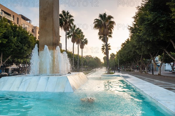 Sculpture and water fountain in the Belen street of the Rambla de Almeria at sunset