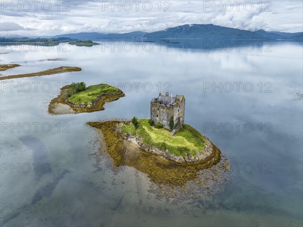 Aerial view of the 14th century island castle Castle Stalker in Loch Laich