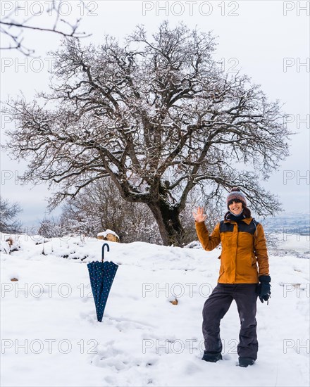 A young girl enjoying a lot in the winter in the snow. Snow in the town of Opakua near Vitoria in Araba