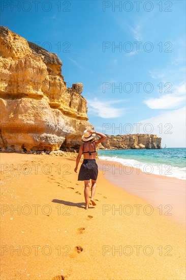 Strolling in summer on the beach at Praia da Coelha