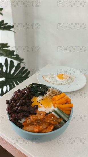 Bulgogi bibimbap korean mix rice bowl with kimchi and kongnamul muchim or steamed soybean sprouts