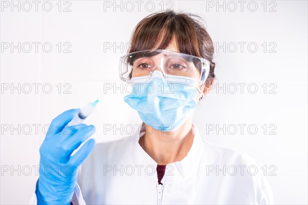 Female doctor with transparent glasses face mask with coronavirus vaccine