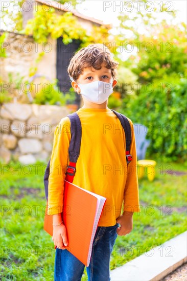 Caucasian child with face mask ready for back to school. New normality