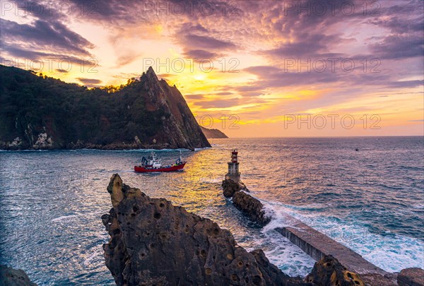 A traditional Basque fishing boat leaving the port of Pasajes San Juan in Gipuzkoa. Basque Country