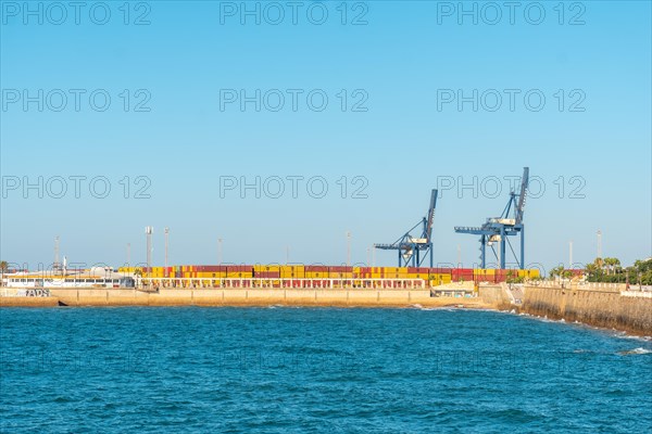 Commercial maritime and industrial cargo port with cranes from the city of Cadiz. Andalusia