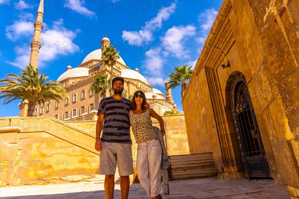 A couple of tourists enjoying the visit to the Alabaster Mosque in the city of Cairo