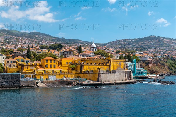 View of the seaside fort of Forte de Sao Tiago on Funchal beach in summer. Madeira