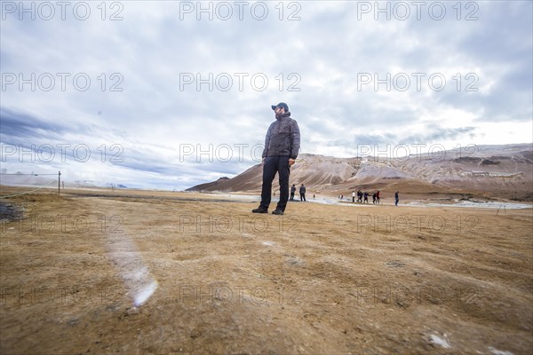 Tourist man visiting the Myvatn park