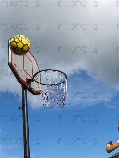 Basketball Jumping with the ball to the basket and net