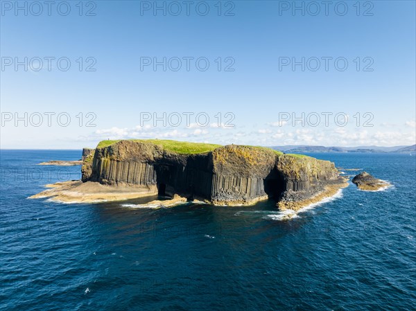 Aerial view of the uninhabited rocky island of Staffa with the prominent basalt columns and Fingal's Cave