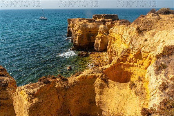 Holes in the beautiful coast in summer at Praia da Coelha