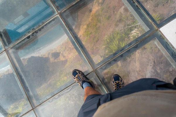 Looking at the glass floor at the highest viewpoint called Cabo Girao in Funchal. Madeira