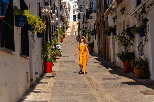 A tourist in Mijas visiting the white houses and charming town. Malaga