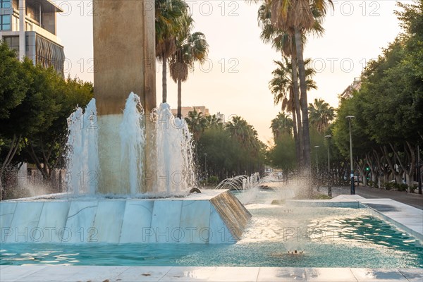 Sculpture and water fountain in the Belen street of the Rambla de Almeria at sunset