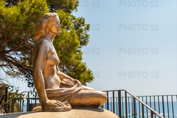 Mermaid sculpture in Cala Canyet next to the town of Tossa de Mar. Girona