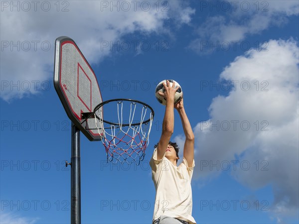 Basketball Jumping with the ball to the basket and net