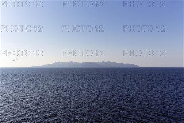 Silhouette of the island of Elba on the horizon