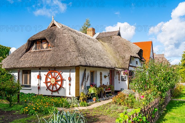 Garden and thatched house in the fishing village of Wieck