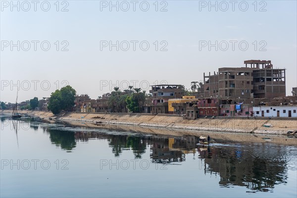 Traditional Egyptian villages on the bank of the river Nile. Views sailing on the cruise on the river Nile from Luxor to Aswer