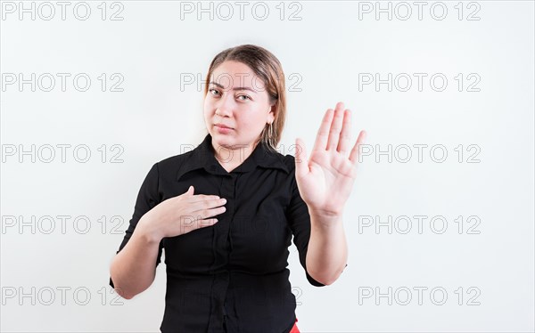 Young woman rejecting with the palm of hand isolated. People gesturing stop isolated. Latin girl gesturing stop with palm hand isolated